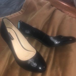 Navy patent leather pumps